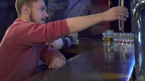 Man tastes beer at the pub Stock Footage 73717001