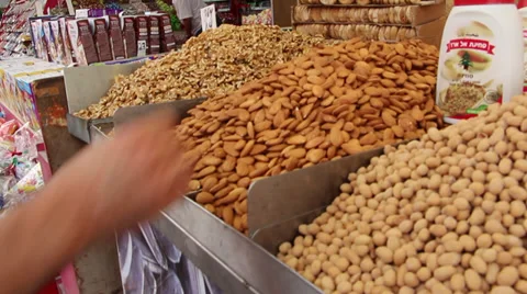 Man tasting almonds Stock Footage 35751913