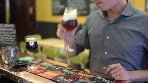 Man Tasting Craft Beer Flight At Bar Counter Stock Footage 344300654