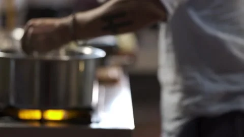A man tasting a hot soup with spoon  Stock Footage 145354775
