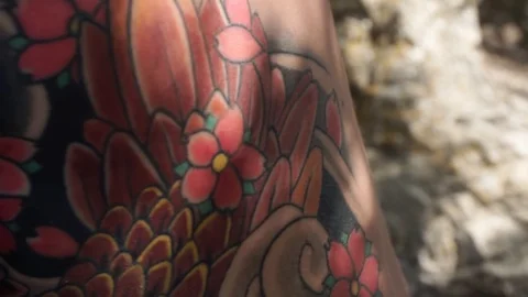 Man with a tattoo on his back is doing something Video stock 102780327