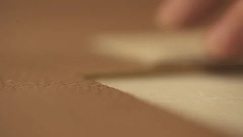 A Man With Tattoos Cutting Leather With A Sharp Knife In The Workshop Closeup Stock Footage 266127656