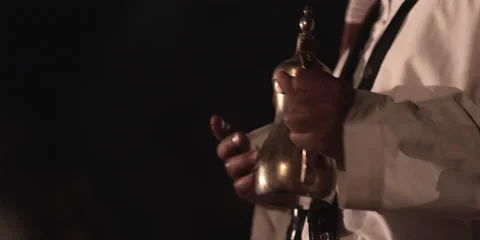 A man with a tea jug and cups. Stock Footage 46870734