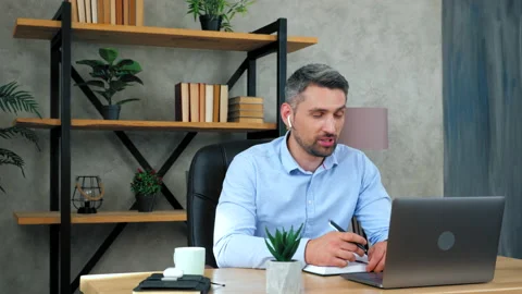 Man teacher communicates with students video call conference web camera laptop Stock Footage 138761742