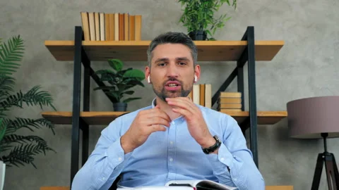 Man teacher teaches communicates students video conference web camera laptop Stock Footage 139912101