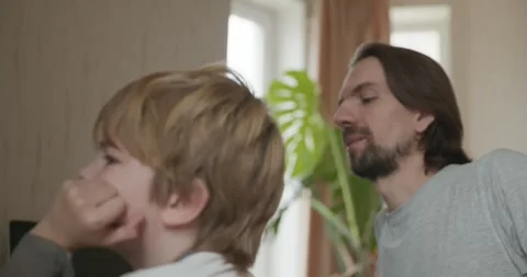 Man Teaches Kid Boy to Play Chess on Computer. 4K 10-bit Stock Footage 320170206