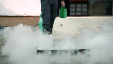 Man teaches or training how to use carbon dioxide (CO2) fire extinguishers Stock Footage 222069954