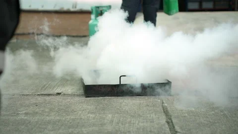 Man teaches or training how to use carbon dioxide (CO2) fire extinguishers. Stock-Footage 222069966