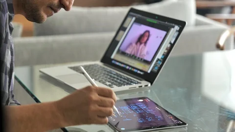 Man teaching an online mathematic class via video call and tablet Stock Footage 128260444