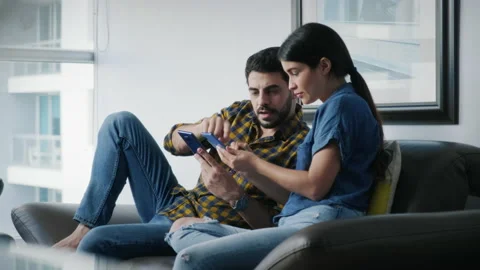 Man Teaching Phone App Technology To Girlfriend With Smartphone Stock Footage 138648602