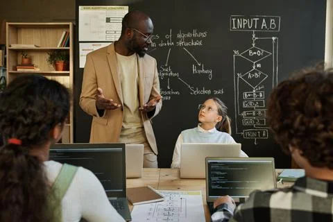 Man teaching young developers at class Stock Photos