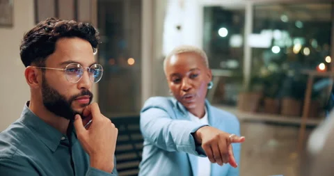 Man, team and advice on tech in office for chart patterns, market timing and Stock Footage 336308091