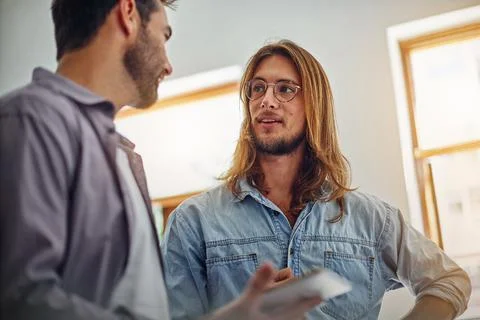 Man, team and tablet in office for meeting, technical briefing and project .. Stock Photos