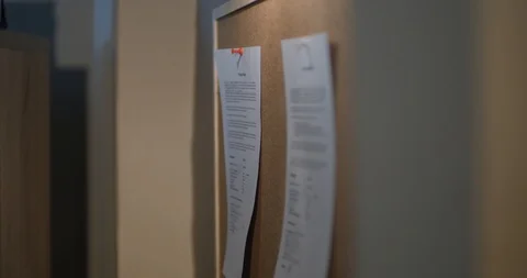 A man tear off a sheet from a wall Video stock 87322981