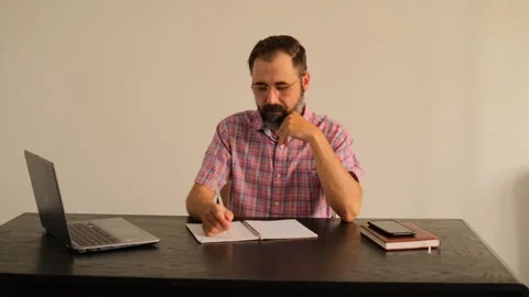 Man tearing out a sheet from a notebook Video stock 245225194
