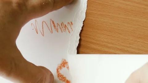 Man is tearing paper Stock Footage 78913355