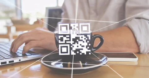 Man in tech typing at cafe table, animated QR appearing, glitching, overlaying Stock Footage 326974090