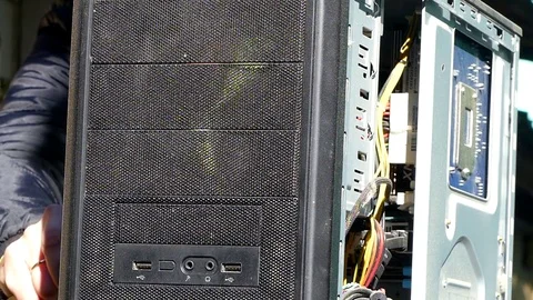 Man technician blows the computer from dust Stock Footage 82344345