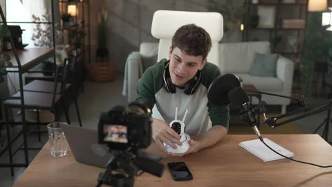 Man technology blogger record video blog or v-log of home cctv camera Stock Footage 292561213