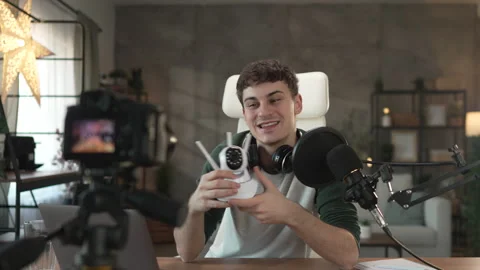 Man technology blogger record video blog or v-log of home cctv camera Stock Footage 292561640