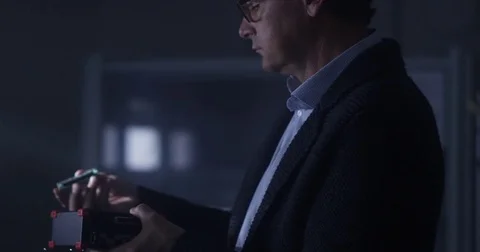 Man with technology components in his hands 76573841