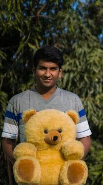 Man with teddy bears Stock Photos