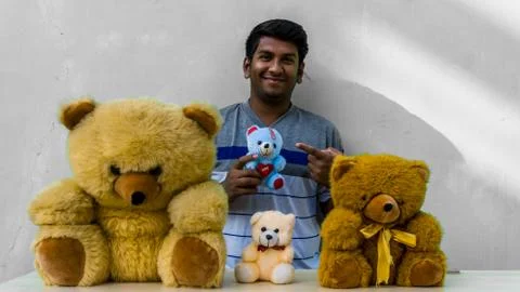 Man with teddy bears Stock Photos