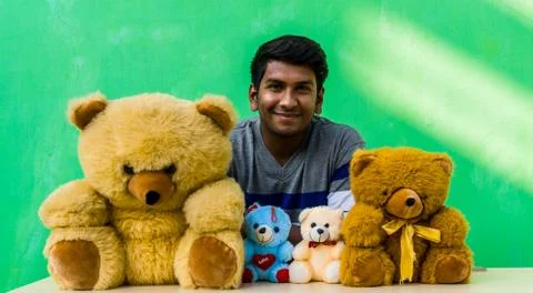 Man with teddy bears Stock Photos