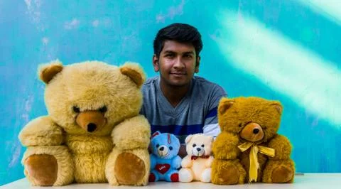 Man with teddy bears Stock Photos