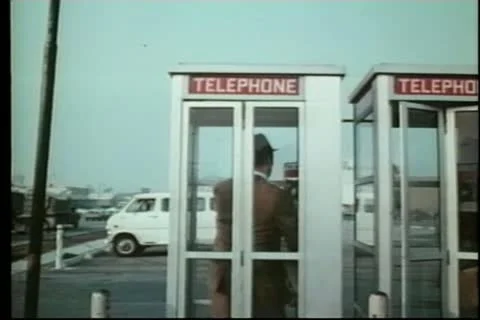 Man in telephone booth Stock Footage 11355339