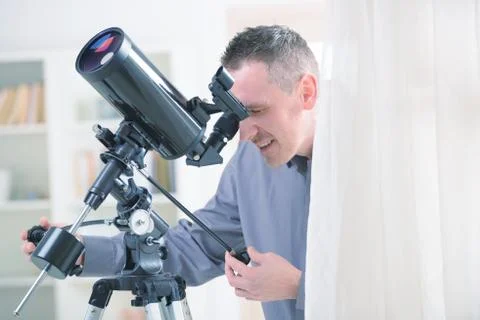 Man with telescope Stock Photos