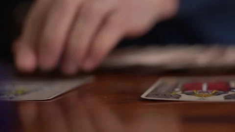 Man telling fortune out of the cards showing a Tarot Stock Footage 162980932