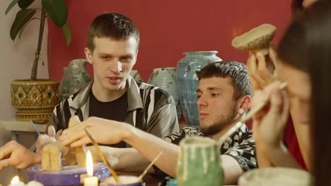 The man is telling something to the craftsman while he is correcting the defects Stock Footage 246362193