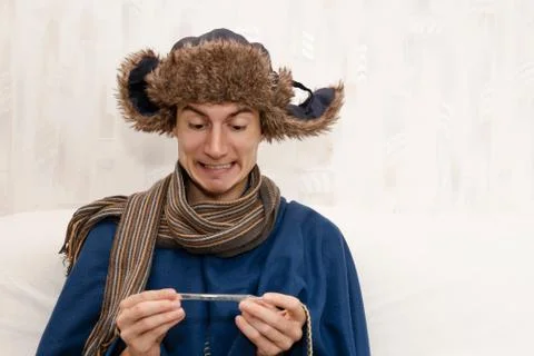 Man with a temperature and flu getting well. Sore throat, cold, influenza. Stock-Fotos