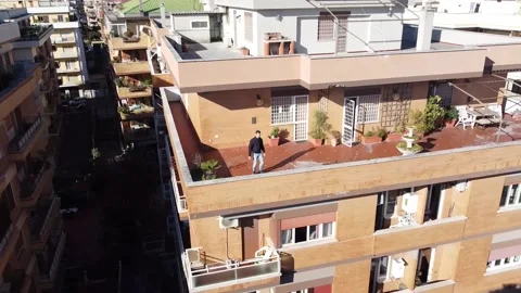 Man on a terrace in Rome during the lockdown Stock Footage 145935490