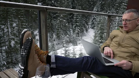 Man on the terrace using a laptop Stock Footage 265173732