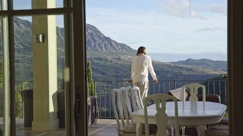 A man on a terrace watching the sunset Stock Footage 231114919