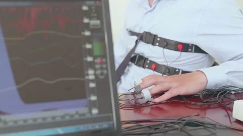 A man is tested on a polygraph Stock Footage 158988631