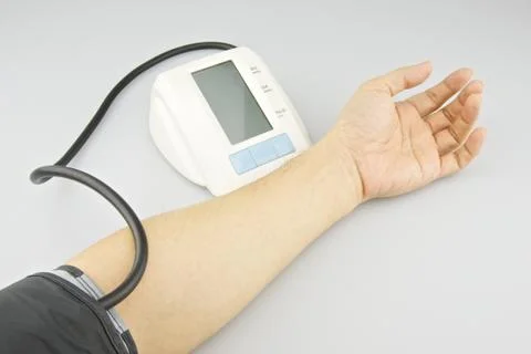 Man is testing blood pressure on left arm Stock Photos