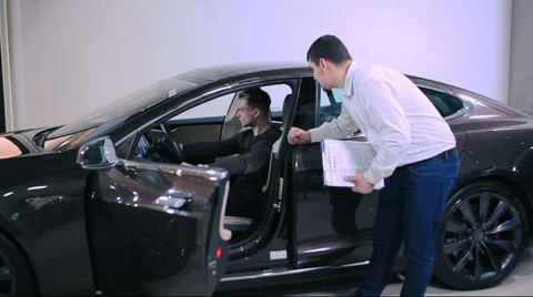 Man testing electric car Stock Footage 68191246