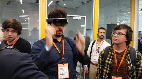 Man testing hololens VR glasses at VR conference Stock Footage