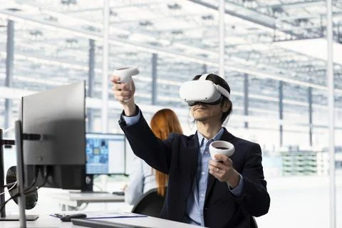 Man testing microchip electronics prototypes using VR tech Stock Photos