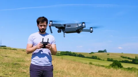 Man testing out a remote controlled drone Stock Footage 91958064