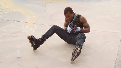 Man Testing rollerblades,in a park. Stock Footage 110823550