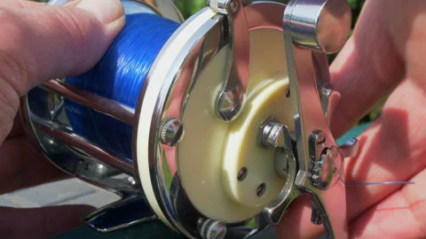 Man testing a seafishing reel before use. Stock Footage 134624218