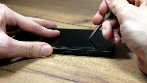 Man testing tempered glass screen protector Stock Footage 149031434