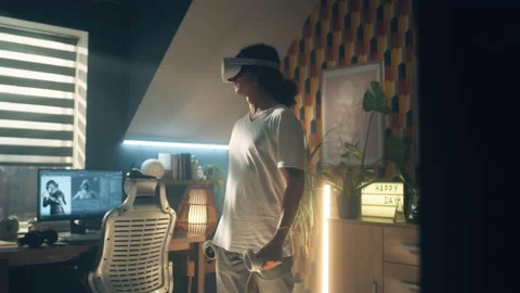 Man testing video game in VR goggles Stock Footage 211800425