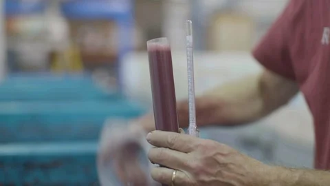 Man testing wine on measuring cylinders glass Stock Footage 87839744