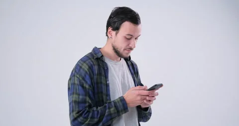 Man text messaging on mobile phone in slow motion Stock Footage 143943025