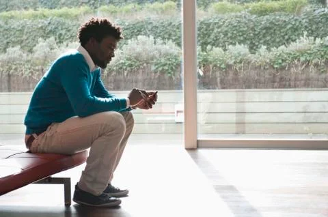 Man text messaging on a mobile phone Stock Photos